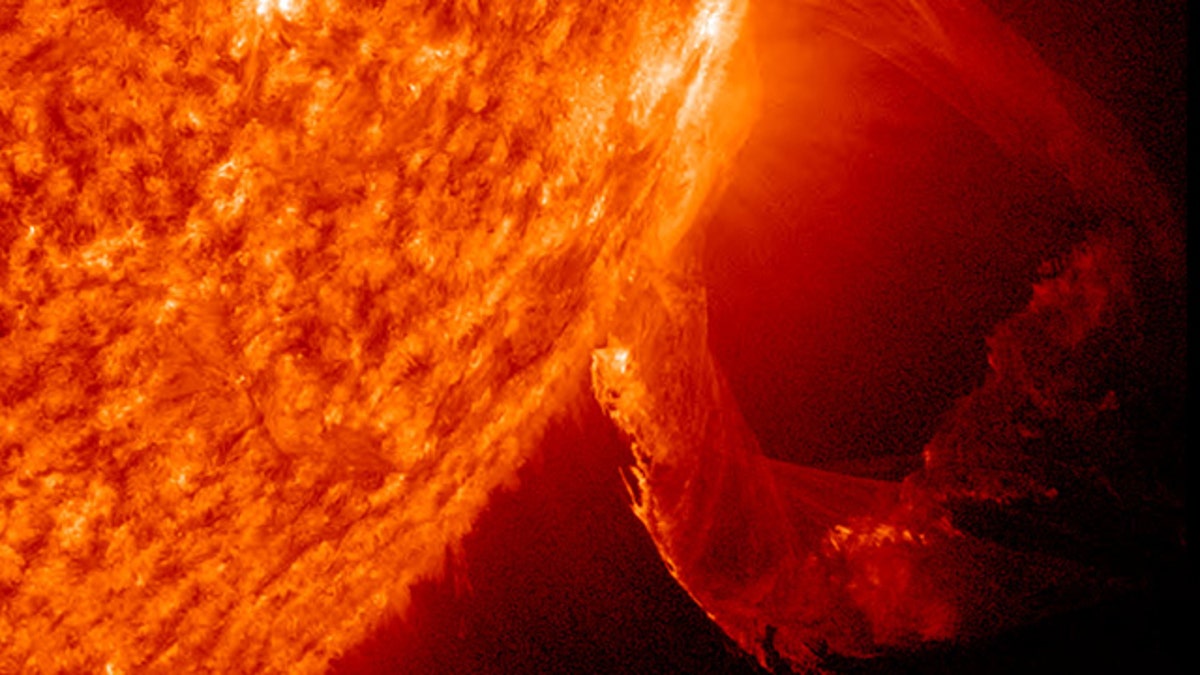 Solar flare: A magnetic eruption on the Sun blows off a towering spire of  plasma.