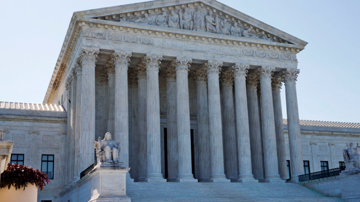 June 29, 2015: Members of security stand outside of the Supreme Court in Washington.