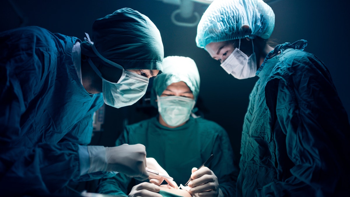 surgeons in surgery istock large