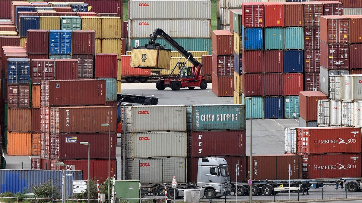 Containers are stored for export at a harbor in Duisburg, Germany, Monday, April 30, 2018. (AP Photo/Martin Meissner)
