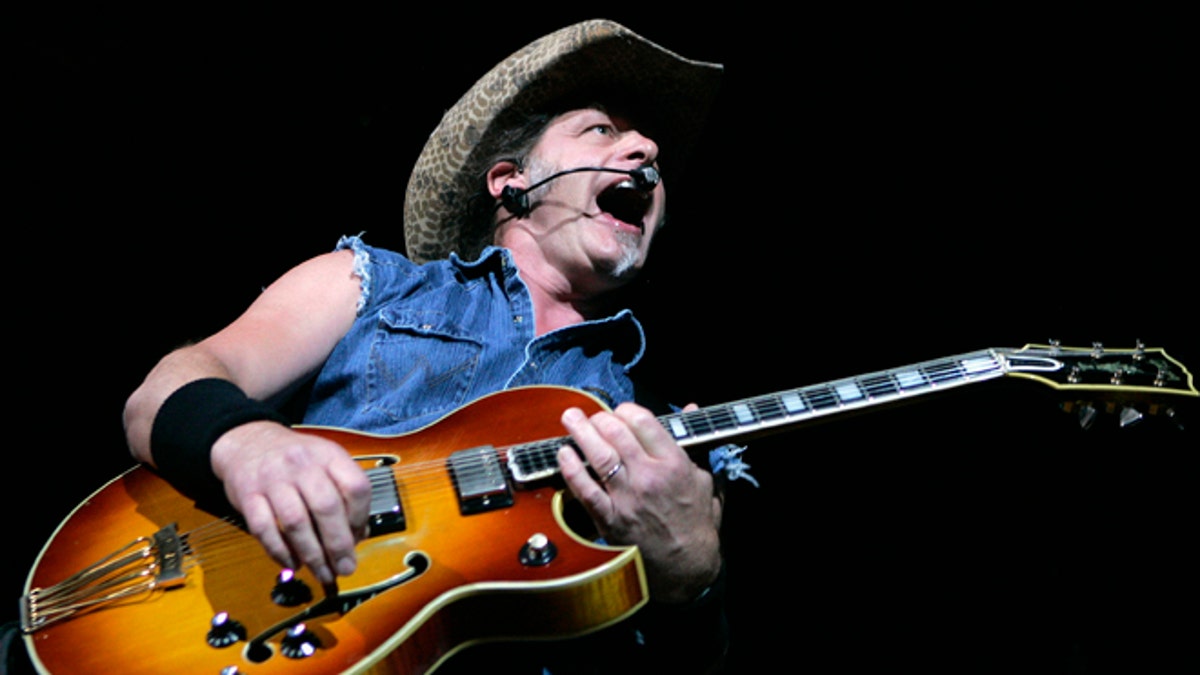 Ted Nugent performs at a concert at the House of Blues at the Mandalay Bay Resort in Las Vegas, Nevada in this file image from August 11, 2007. Republican candidate Mitt Romney's campaign called for civility on Tuesday after aging rock star Nugent made an apparent threat against President Barack Obama before an audience of U.S. gun lobbyists. Nugent told the National Rifle Association convention in St. Louis last week that "If Barack Obama becomes the president in November again, I will either be dead or in jail by this time next year." REUTERS/Steve Marcus (UNITED STATES - Tags: ENTERTAINMENT SOCIETY PROFILE POLITICS) - RTR30WBM
