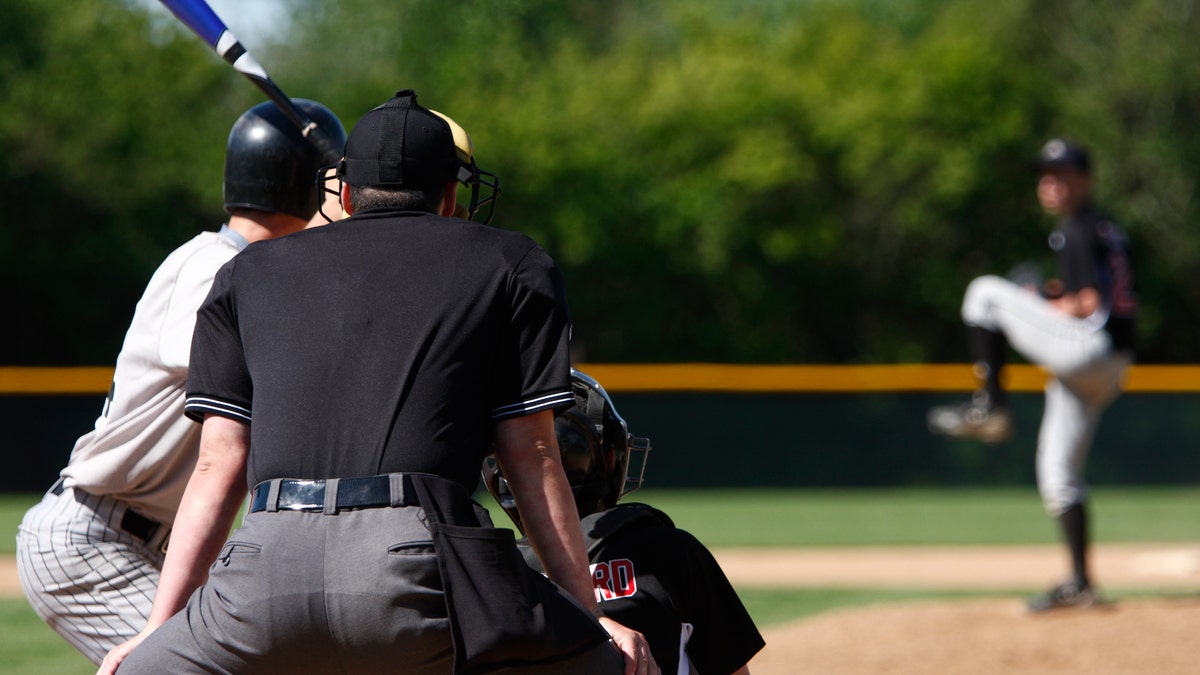 teenagers playing baseball istock