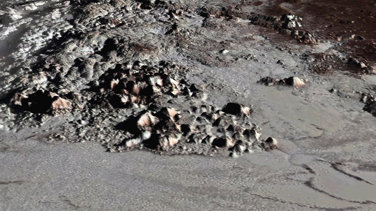 An image of the Tenzing Montes peaks on Pluto created with New Horizons data and released on July 10, 2018. The mountains range from about 1.8 miles to 3.7 miles (3 to 6 kilometers) above the dwarf planet's surface.