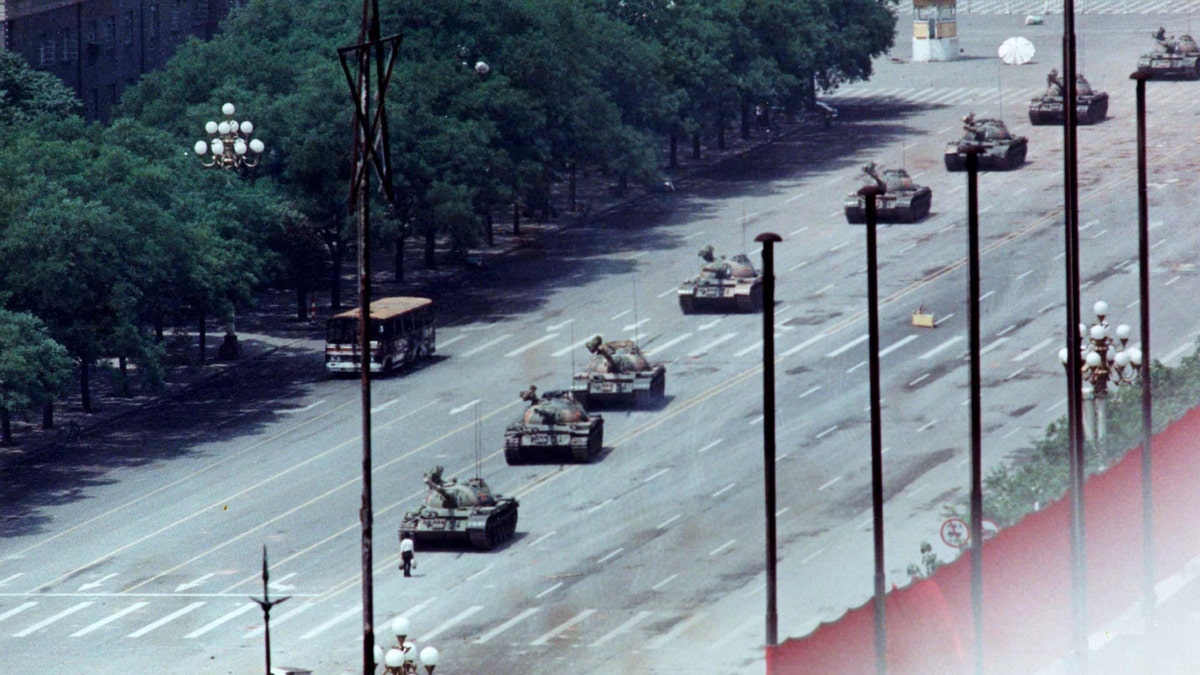 A man blocking tanks