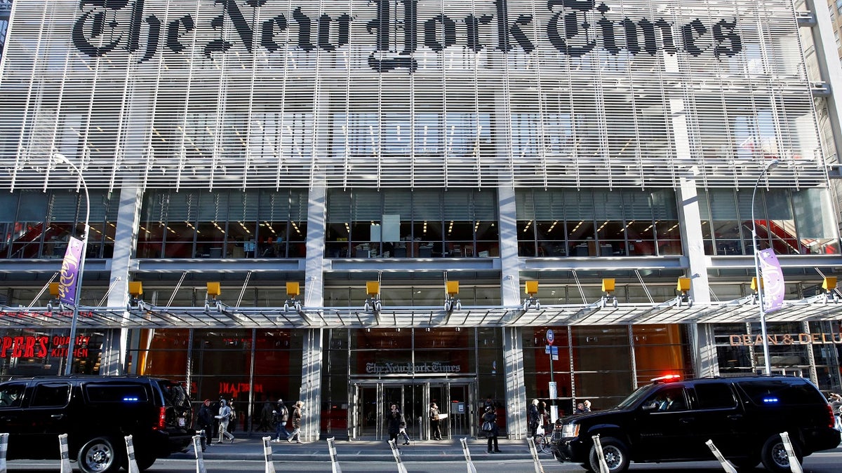 The motorcade of U.S. President-elect Donald Trump makes its way past the New York Times building after a meeting in New York U.S., November 22, 2016. REUTERS/Shannon Stapleton - S1AEUOIXBEAC