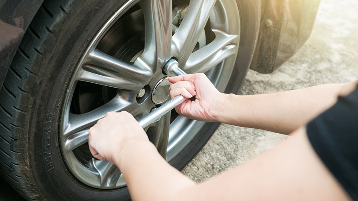 Mechanic changes tire 