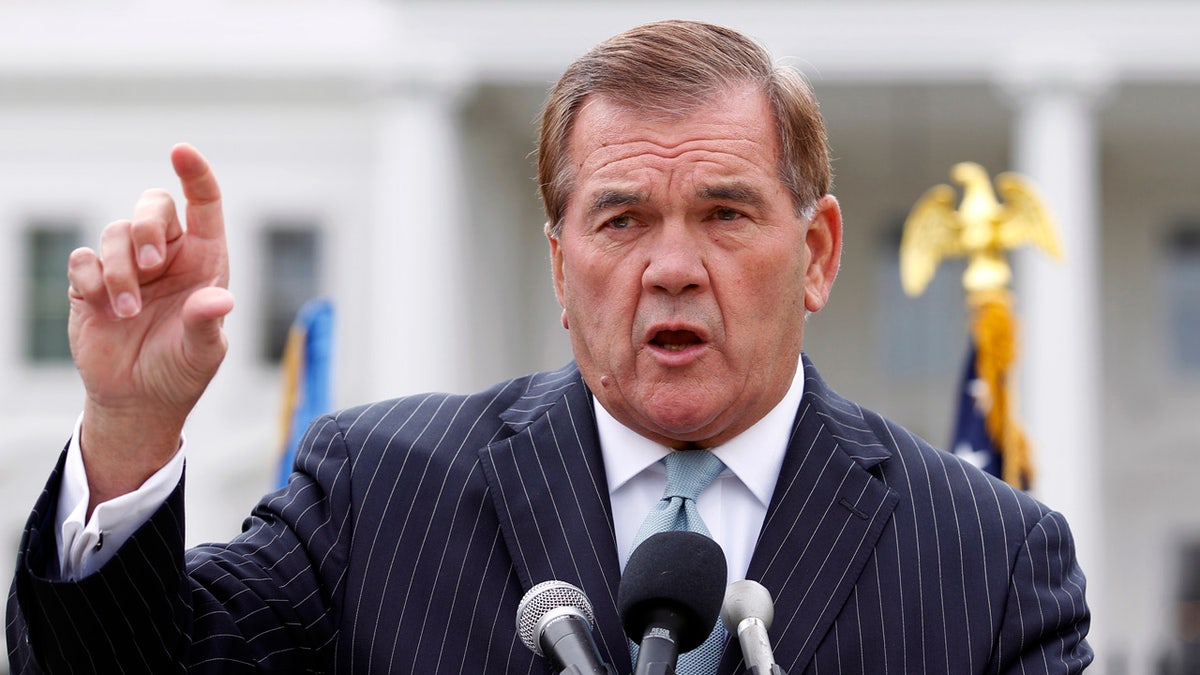 FILE - In this Oct. 22, 2011, file photo, former Secretary of Homeland Security Tom Ridge speaks to a crowd of hundreds protesting in front of the White House in Washington. A spokesman says Ridge is in critical condition after undergoing an emergency heart procedure at a hospital in Austin, Texas. (AP Photo/Jose Luis Magana, File)