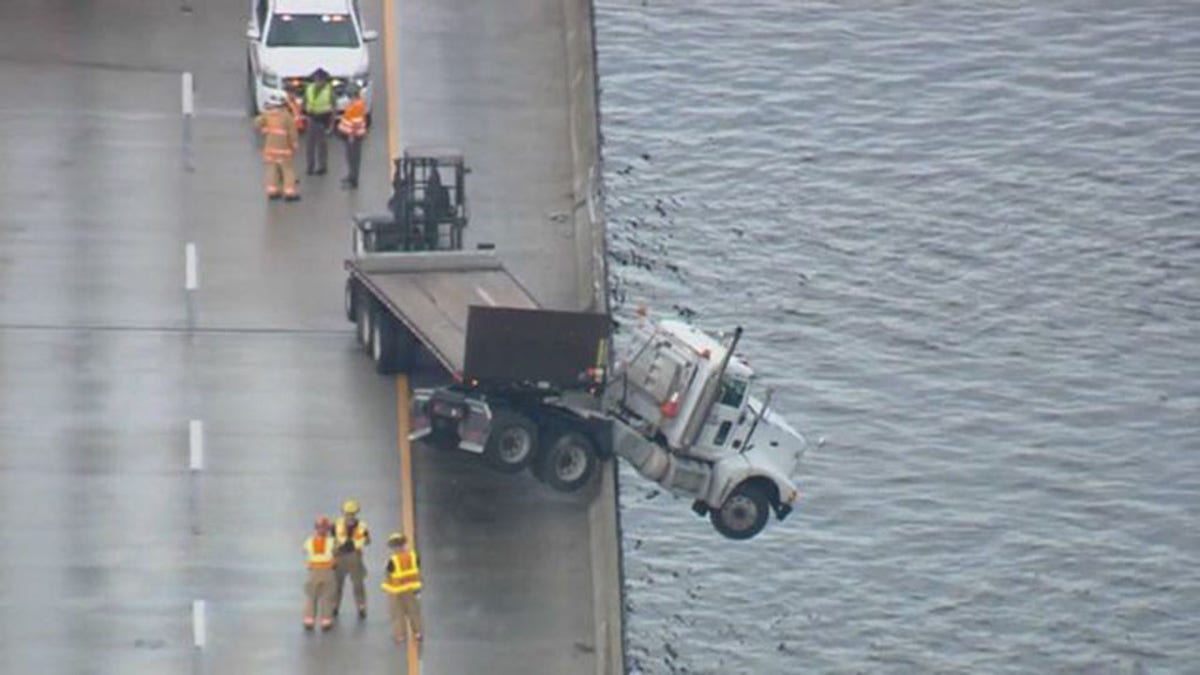 Semi-truck Backs Up Traffic After Dangling Off Overpass | Fox News