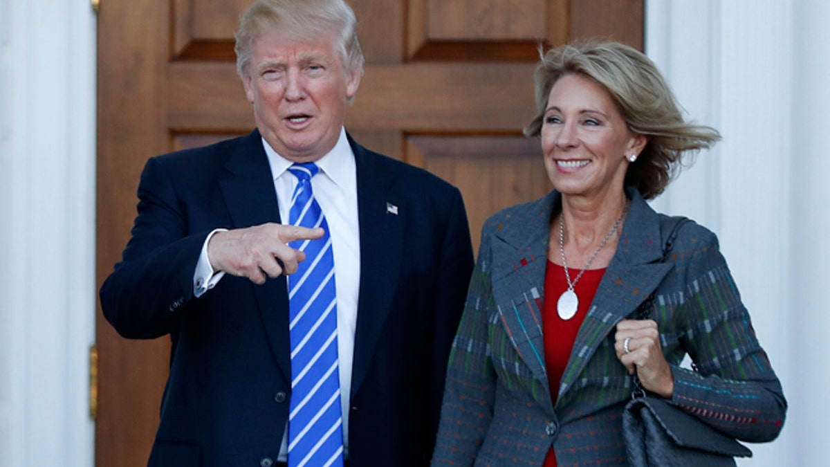 trump-devos-assault