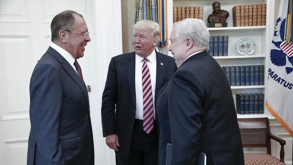 Russian ambassador Sergey Kislyak, at right, meets with President Trump and Russian Foreign Minister Sergey Lavrov. The May 10, 2017 meeting took place the same day Trump fired James Comey as FBI Director. Trump was widely criticized during the meeting for revealing information to the Russians about intelligence obtained from Israel about an ISIS terror plot involving laptop bombs. Although the president has the authority to disclose classified information, critics charged the move was reckless and endangered Israeli sources. (AP)