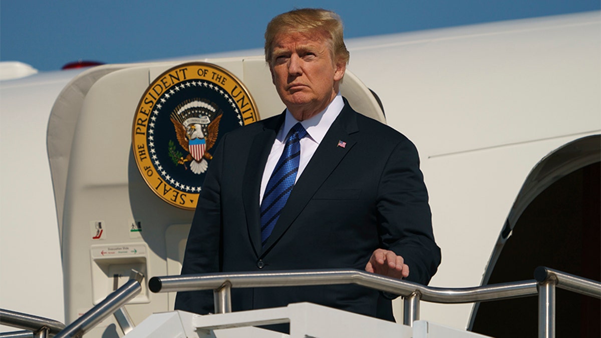 President Donald Trump arrives on Air Force One at Morristown Municipal Airport, in Morristown, N.J., Friday, July 20, 2018, en route to Trump National Golf Club in Bedminster, N.J.. (AP Photo/Carolyn Kaster)