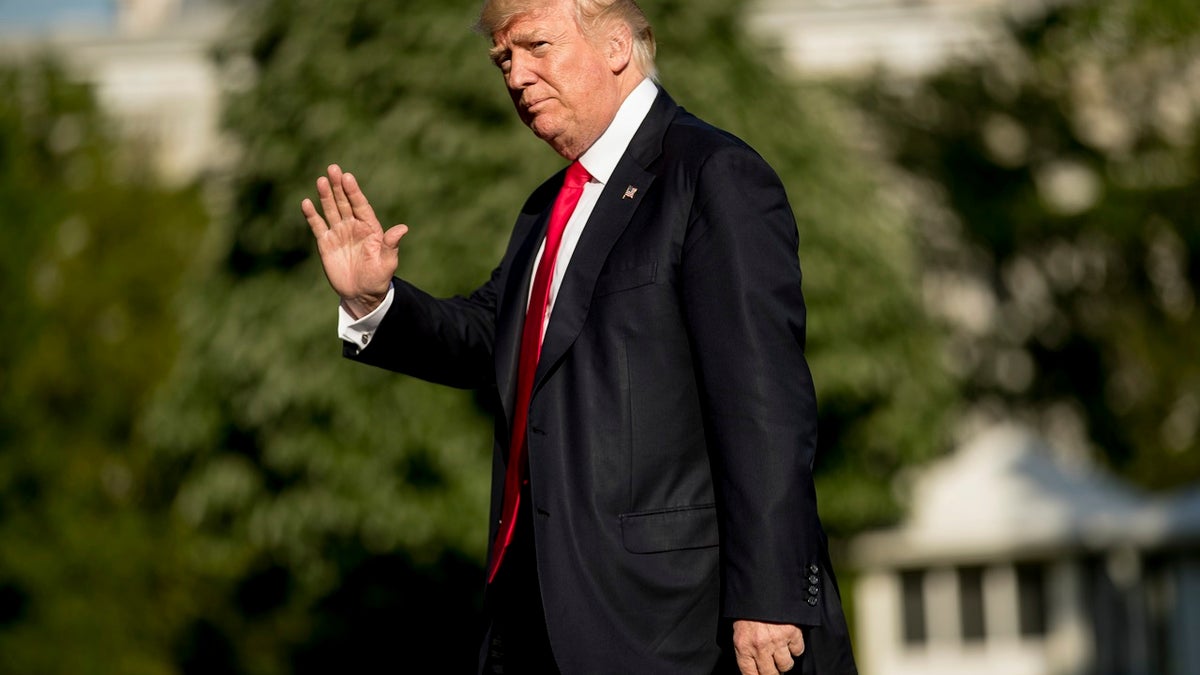 President Donald Trump walks across the South Lawn as he arrives at the White House in Washington, Friday, April 28, 2017, returning from traveling to Atlanta to speak at the National Rifle Association Leadership Forum. (AP Photo/Andrew Harnik)