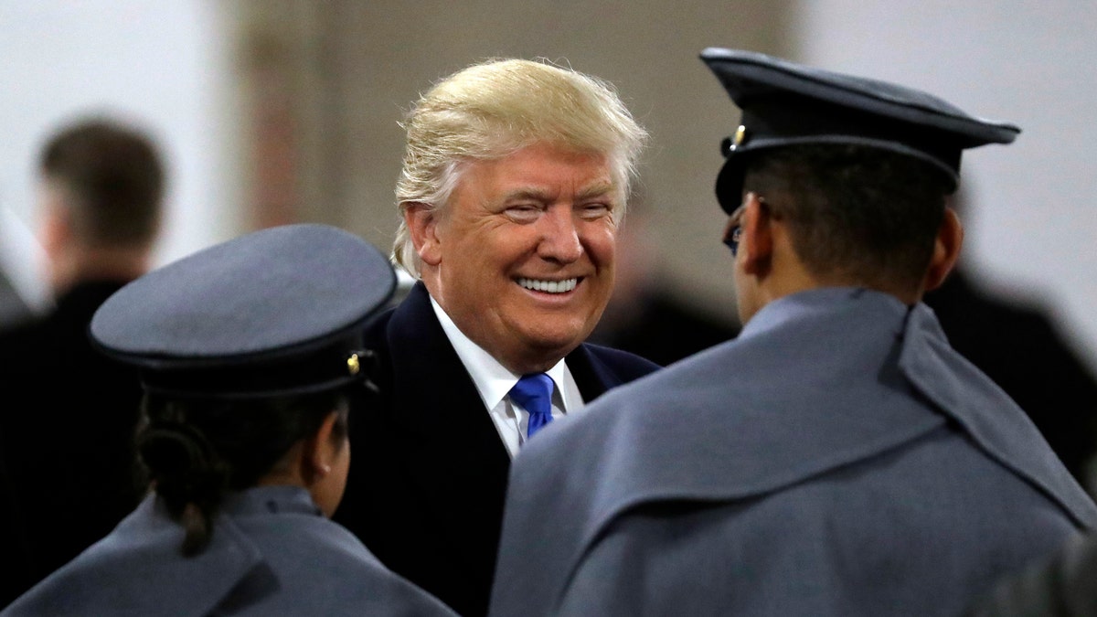 President-elect Donald Trump, center, greets Army Cadets before the Army-Navy NCAA college football game in Baltimore, Saturday, Dec. 10, 2016. (AP Photo/Patrick Semansky)