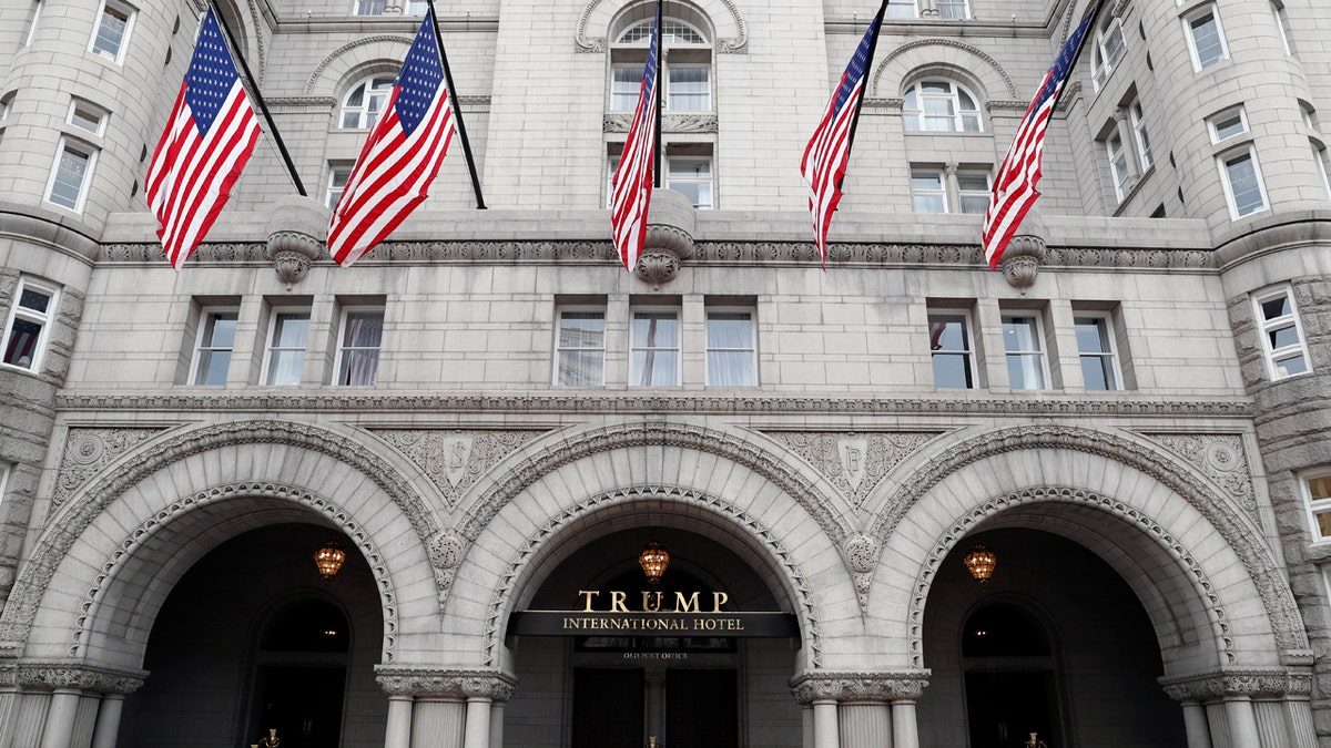 FILE- In this Dec. 21, 2016 file photo, the Trump International Hotel in Washington is shown. On Thursday, Dec. 21, 2017, a New York judge has rejected a lawsuit by restaurant workers, a hotel event booker and a watchdog group who say President Donald Trump has business conflicts that violate the Constitution. The lawsuit was rejected by federal Judge George Daniels, who says the plaintiffs lacked standing to sue. (AP Photo/Alex Brandon, File)