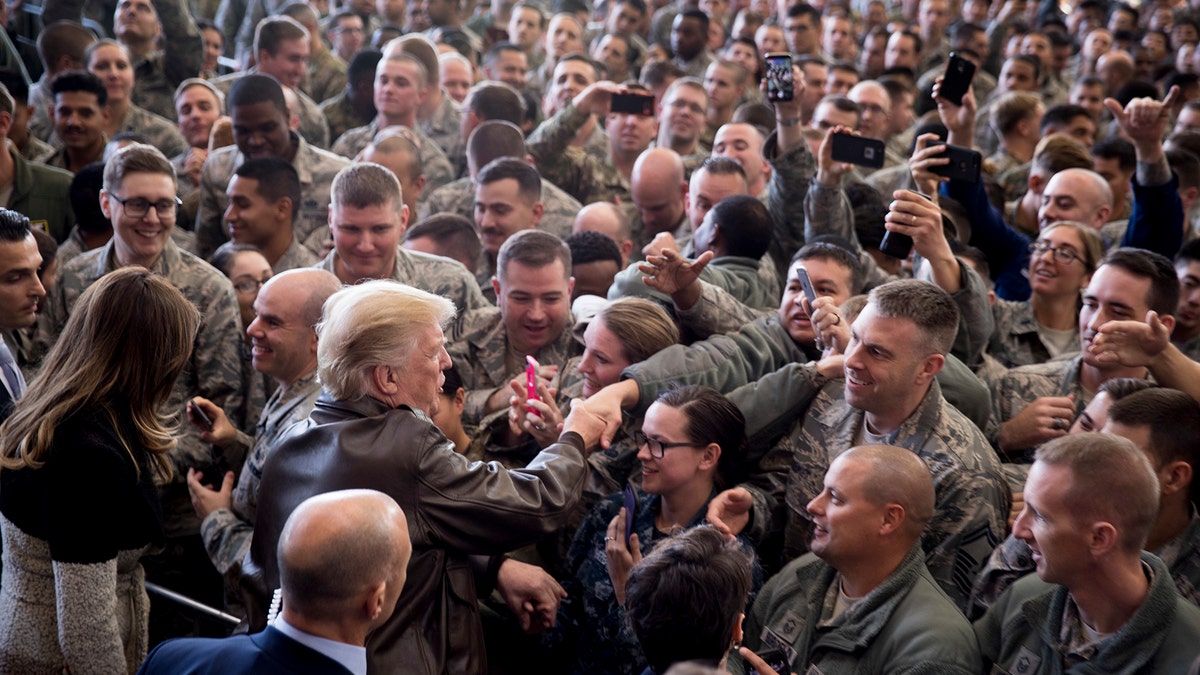 President Donald Trump is greeting the members of the army after he spoke at the march of hanger at Yokota Air Force Base, on Sunday, November 5, 2017, in Fossa, on the outskirts of Tokyo, Japan. Trump is on a five -country trip through Asia to travel to Japan, South Korea, China, Vietnam and the Philippines. (AP Photo/Andrew Harnik)