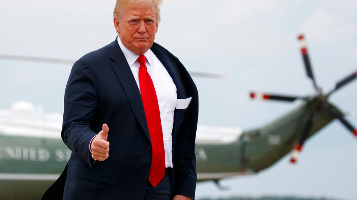 President Donald Trump gives the thumbs-up as he boards Air Force One, Friday, July 27, 2018, in Andrews Air Force Base, Md., en route to Morristown Municipal Airport, in Morristown, N.J., and on to Trump National Golf Club in Bedminster, N.J. (AP Photo/Carolyn Kaster)