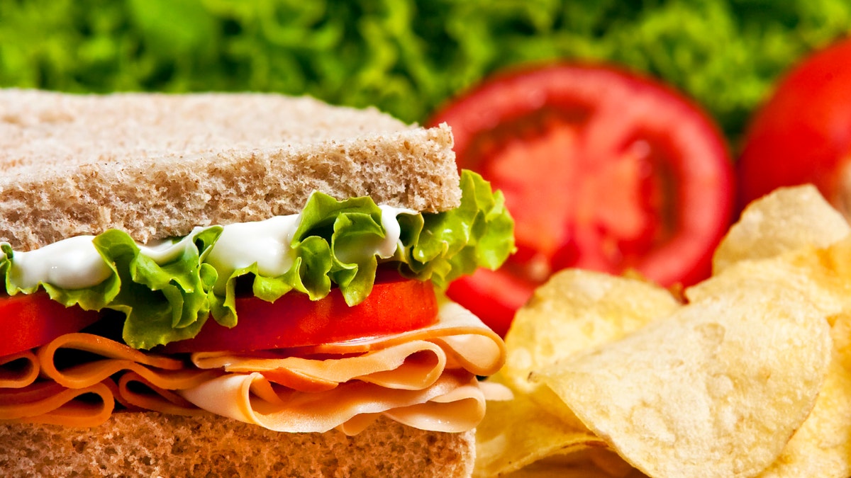 turkey sandwich with potato chips istock