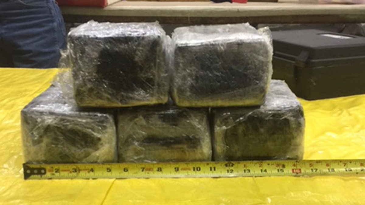 This photo provided by the Tulsa County Sheriff's Office shows some of the 31 pounds of cocaine that was accidentally discovered stashed in the nose of an American Airlines aircraft in Tulsa, Okla., Monday, Jan. 30, 2017. Tulsa County Sheriff's Office spokesman Justin Green says the plane arrived in Miami from Bogota, Colombia, on Sunday. (Tulsa County Sheriff's Office via AP)