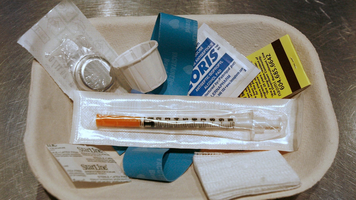 A small kit of supplies containing syringes, bandaids and antiseptic pads waits to be used by a drug addict inside a safe injection site on Vancouver, British Columbia's eastside August 23, 2006. Known as Insite the facility opened three years ago and operates legally after the federal and provincial governments gave their blessing. Inside, addicts can shoot up their own heroin or cocaine under the supervision of a nurse. The Health Canada exemption runs out Sept. 12 and Prime Minister Stephen Harper has said he's 