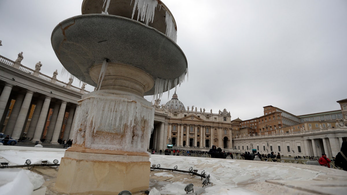 Icicles adorn one of the fountain of St. Peter's Square at the Vatican, Sunday, Jan. 8, 2017, as large areas of Italy are affected by strong winds, snowfall and low temperatures. (AP Photo/Andrew Medichini)