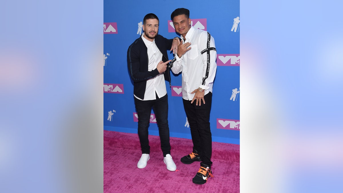 Vinny Guadagnino, left, and Paul "DJ Pauly D" DelVecchio arrive at the MTV Video Music Awards at Radio City Music Hall on Monday, Aug. 20, 2018, in New York. (Photo by Evan Agostini/Invision/AP)