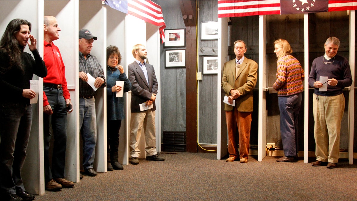 FILE: Nov. 6, 2012: Voters in Dixville Notch, New Hampshire wait to cast the first election day ballots of the U.S. presidential election.