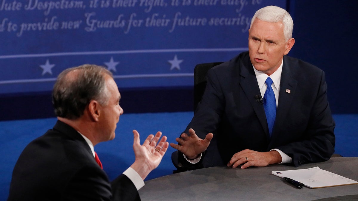 Republican vice-presidential nominee Gov. Mike Pence, right, and Democratic vice-presidential nominee Sen. Tim Kaine debate during the vice-presidential debate at Longwood University in Farmville, Va., Tuesday, Oct. 4, 2016. (Andrew Gombert/Pool via AP)
