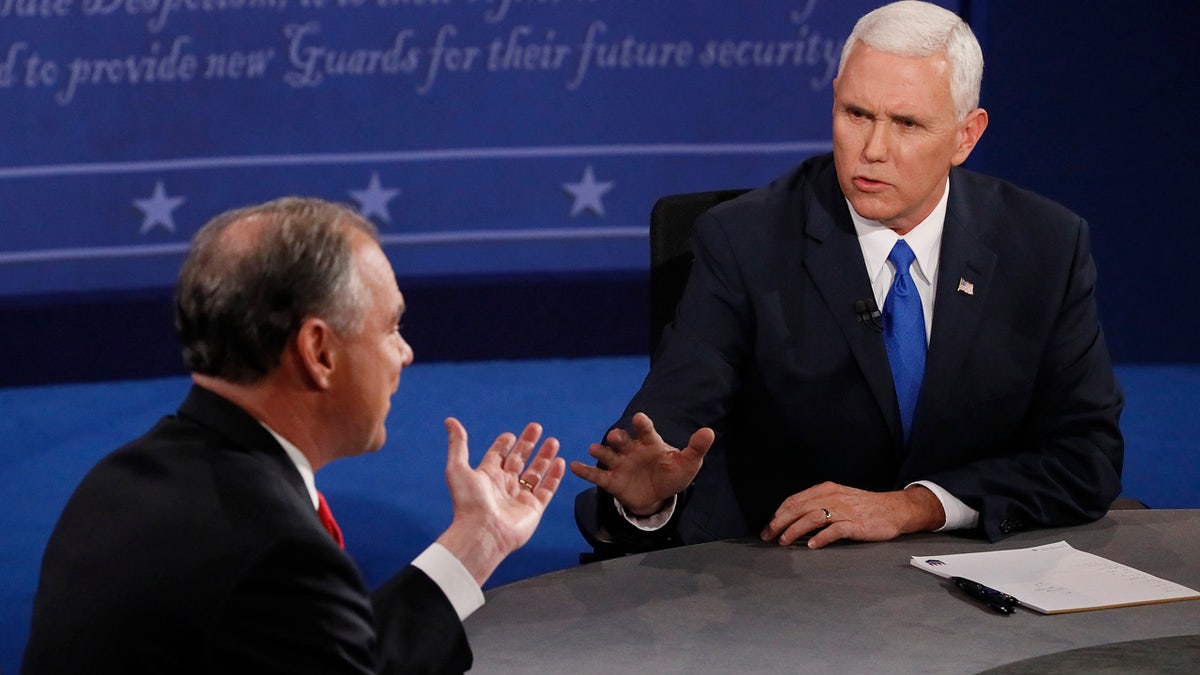 Republican vice-presidential nominee Gov. Mike Pence, right, and Democratic vice-presidential nominee Sen. Tim Kaine debate during the vice-presidential debate at Longwood University in Farmville, Va., Tuesday, Oct. 4, 2016. (Andrew Gombert/Pool via AP)
