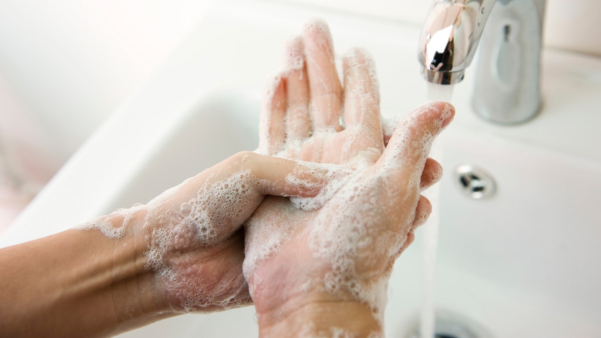 washing hands with soap istock