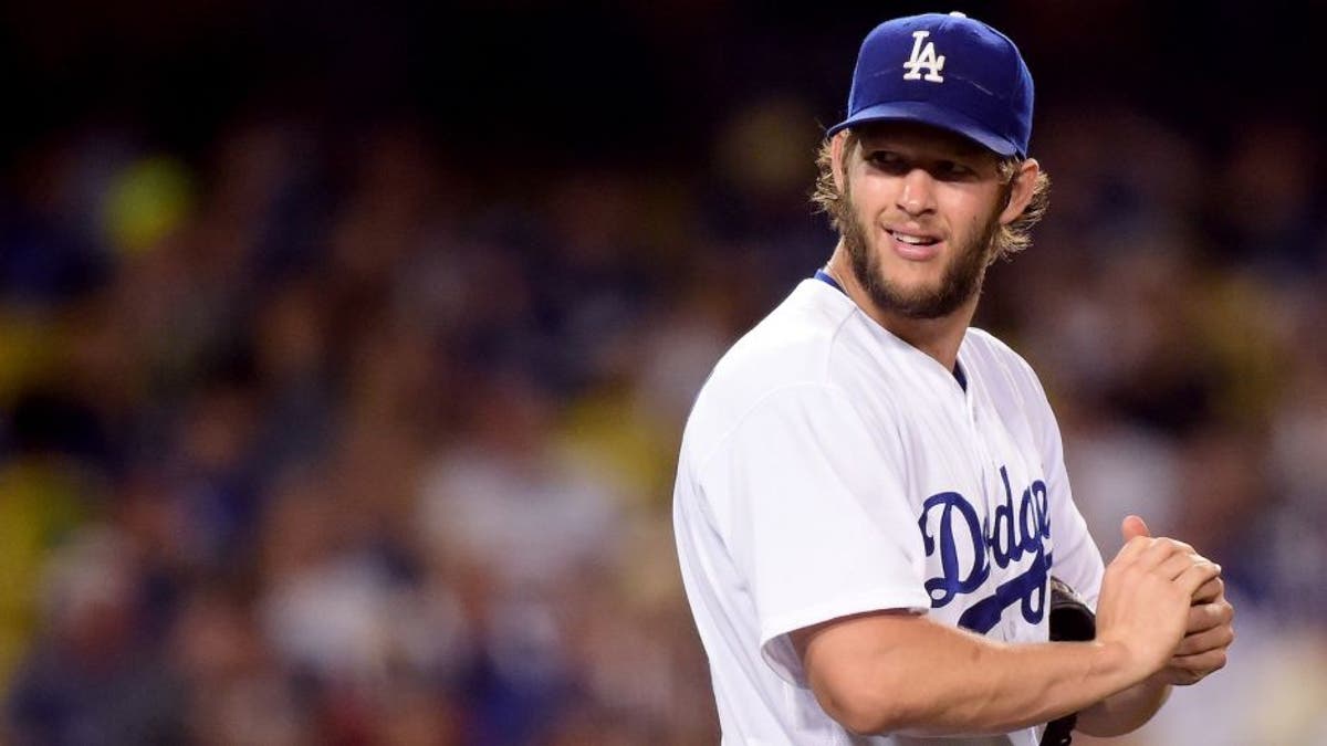 LOS ANGELES, CA - JUNE 20: Clayton Kershaw #22 of the Los Angeles Dodgers reacts to his wild pitch during the seventh inning against the Washington Nationals at Dodger Stadium on June 20, 2016 in Los Angeles, California. (Photo by Harry How/Getty Images)