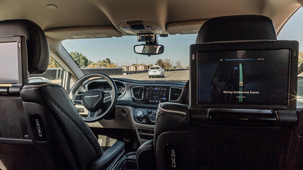 This Sunday, Oct. 29, 2017, photo provided by Waymo shows a Chrysler Pacifica minivan that are equipped with Waymo's self-driving car technology, being tested at Waymo's facility in Atwater, Calif. Waymo, hatched from a Google project started eight years ago, showed off its progress Monday during a rare peek at a closely guarded testing facility located 120 miles southeast of San Francisco where its robots complete their equivalent to driver's education. (Julia Wang/Waymo via AP)