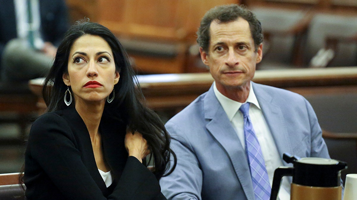 Anthony Weiner, right, and Huma Abedin are seen in court, Wednesday, Sept. 13, 2017 in New York. The couple appeared before a New York City judge to ask for privacy in their divorce case. (Jefferson Siegel/The Daily News via AP, Pool)