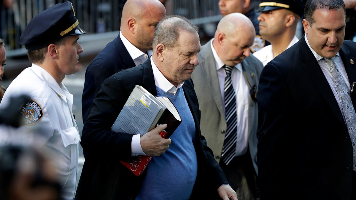 Harvey Weinstein arrives at the first precinct while turning himself to authorities following allegations of sexual misconduct, Friday, May 25, 2018, in New York.