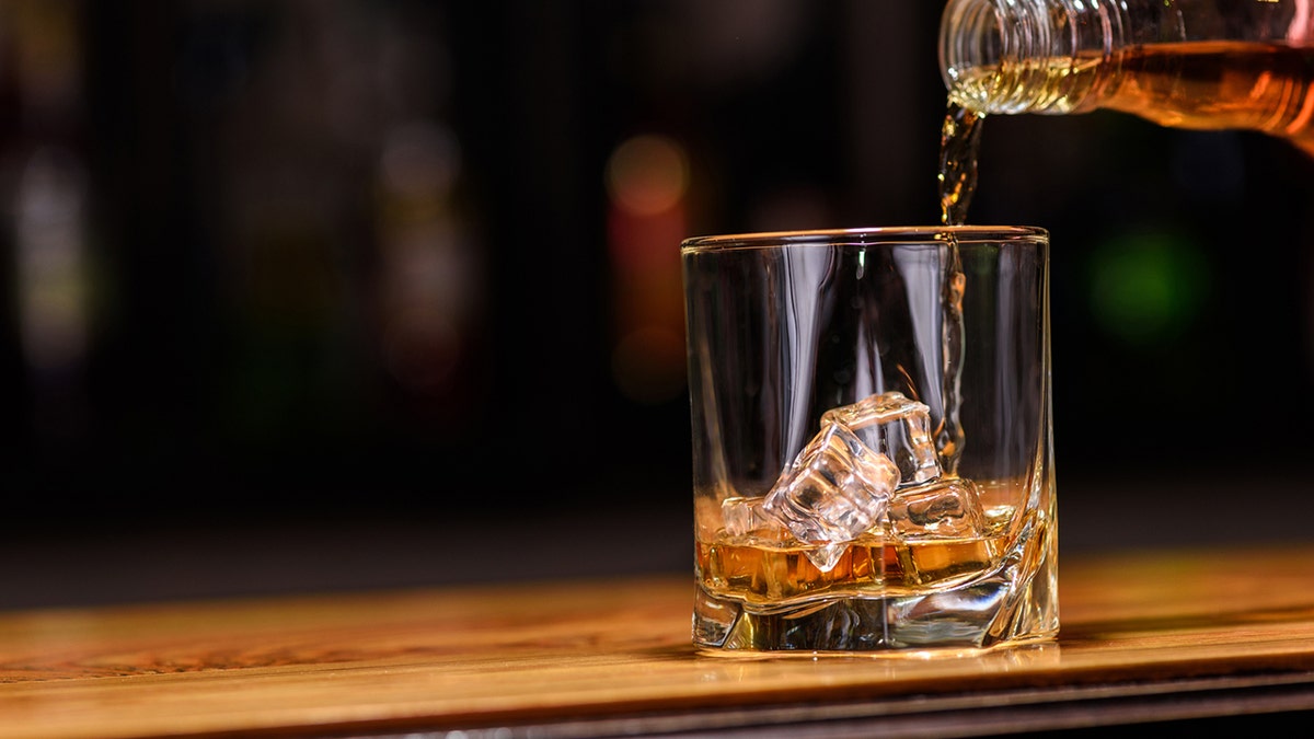 whiskey pour istock