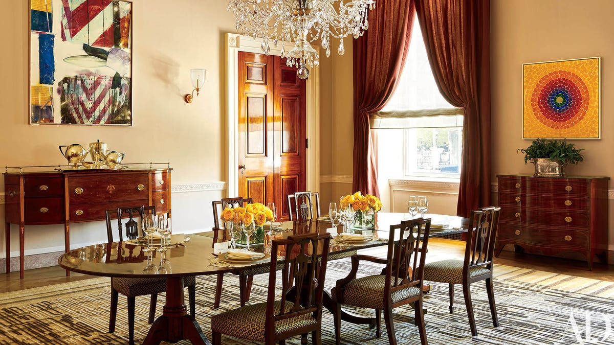 This photo provided by Architectural Digest show the Old Family Dining room in the White House in Washington. Works by Robert Rauschenberg, right, and Alma Thomas, the first African American artist woman represented in the White House, left, make a modern splash. President Barack Obama likes to say the White House is the peoples house. Exclusive photos published by Architectural Digest are giving the public its first glimpse of private areas on the second floor of the White House that Obama, his wife, Michelle, daughters Malia and Sasha and family dogs Bo and Sunny have called home for nearly eight years.(Michael Mundy/Architectural Digest via AP)