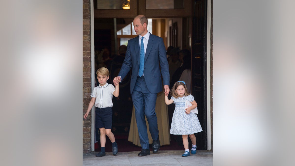 Britain's Prince William with his children Prince George and Princess Charlotte leave after the christening service of Prince Louis at the Chapel Royal, St James's Palace, London, Monday, July 9, 2018. (Dominic Lipinski/Pool Photo via AP)