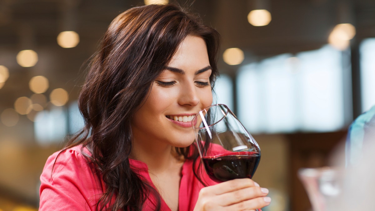 woman drinking wine istock
