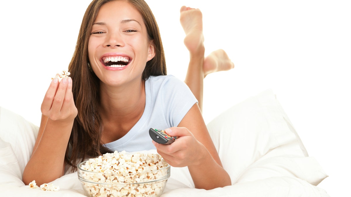 woman eating popcorn istock medium