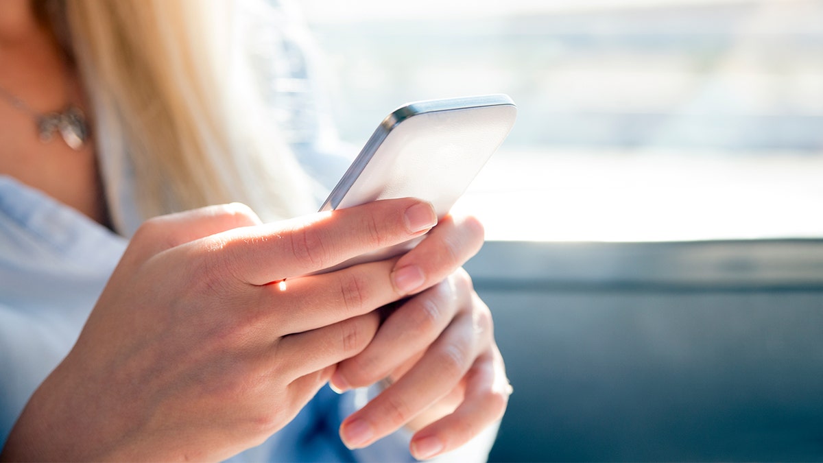 woman on phone istock