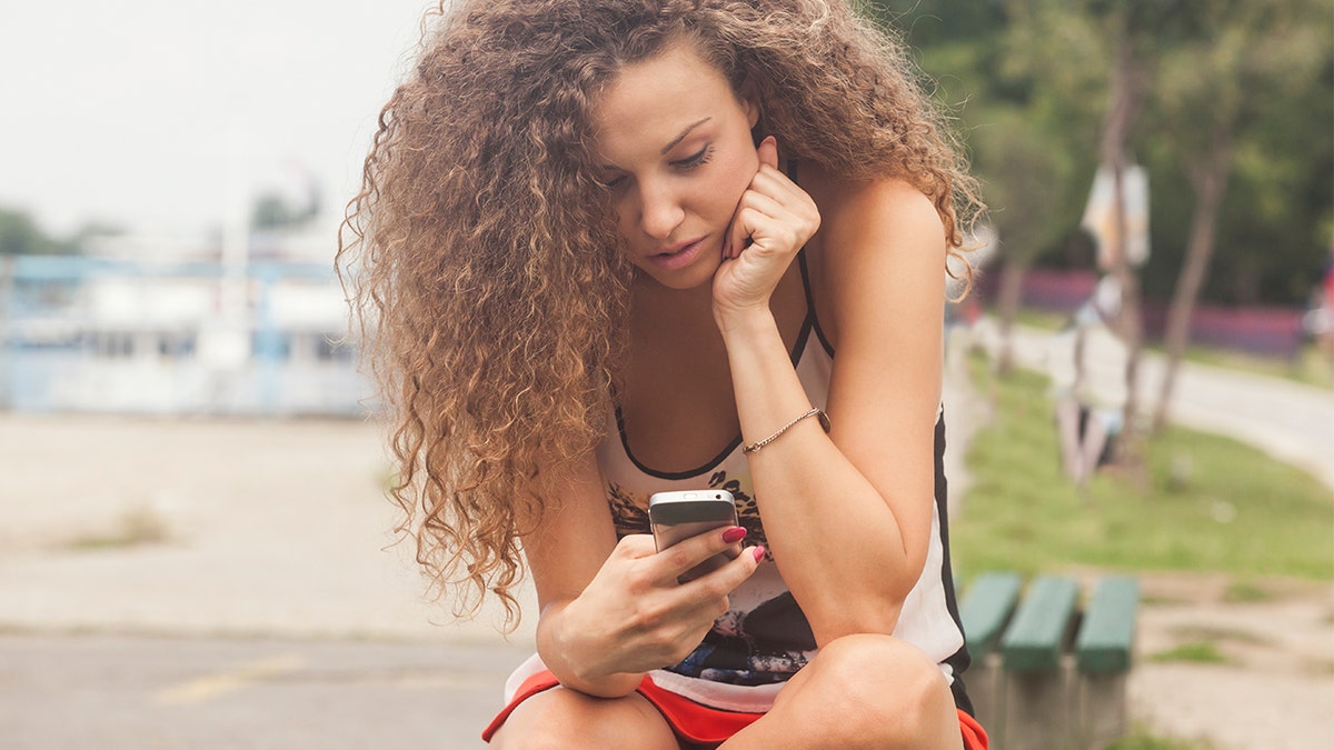 woman looking at phone