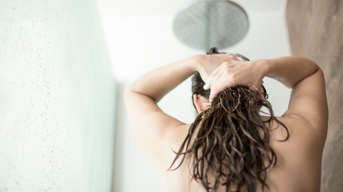 Woman is washing her hair