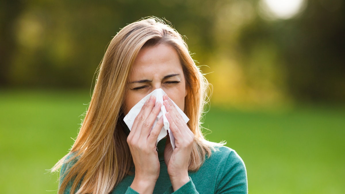 woman with allergies istock