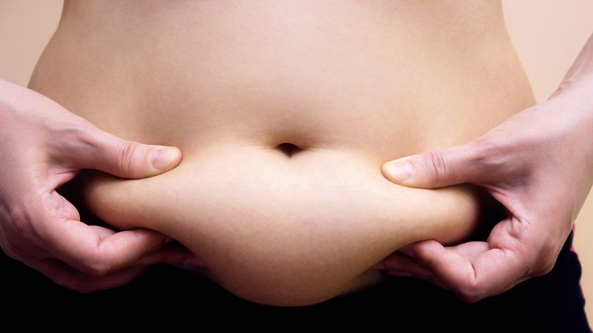 woman with belly fat istock
