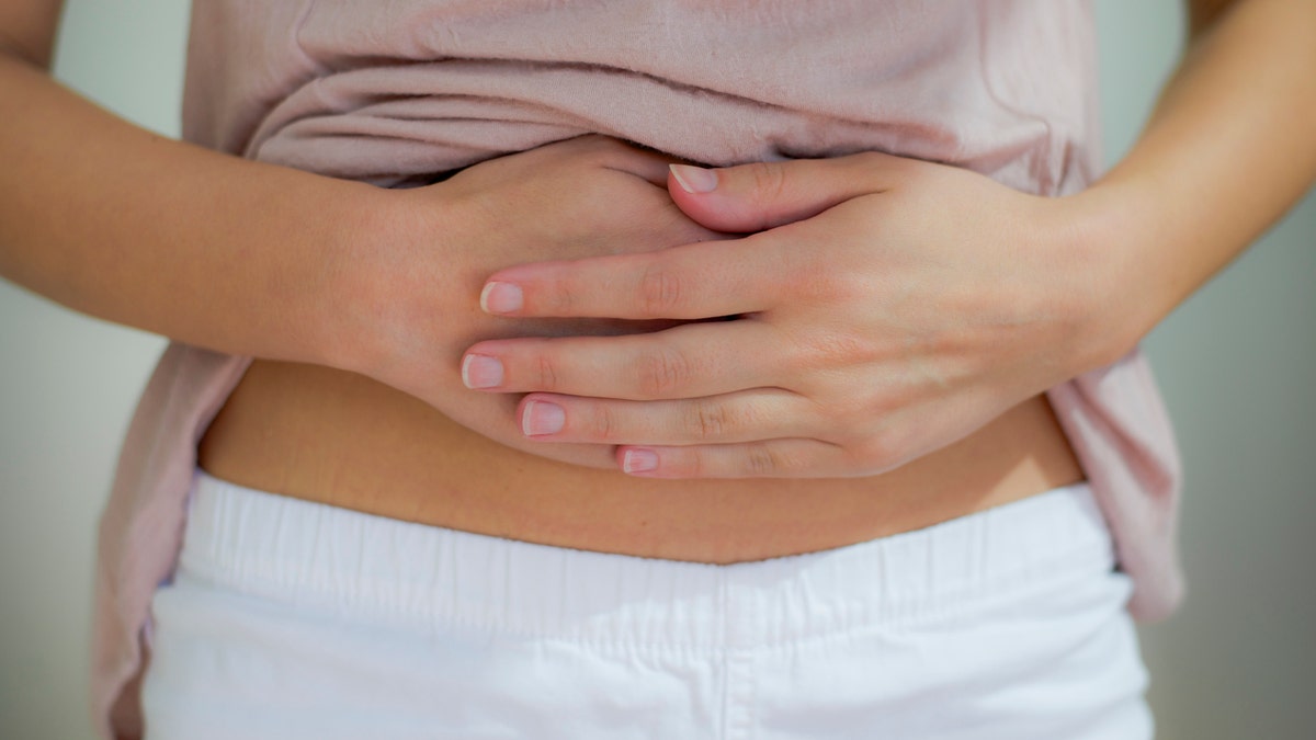 woman with stomach pain stomachache istock medium