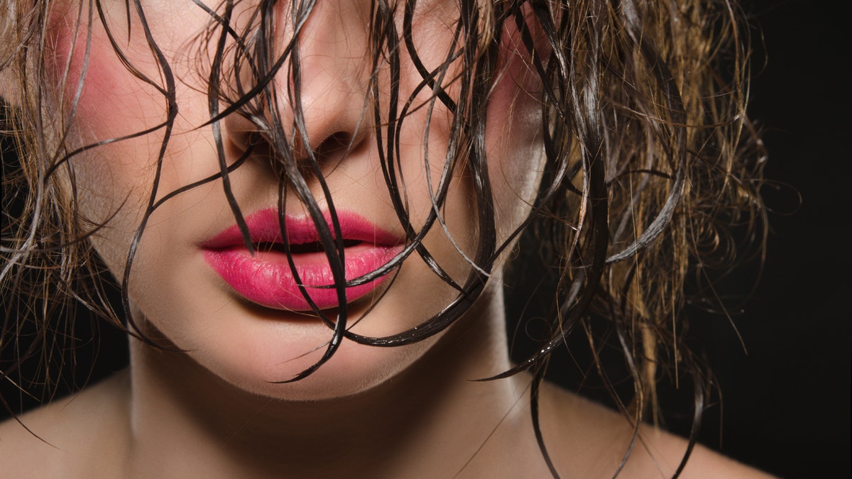 woman with wet hair istock