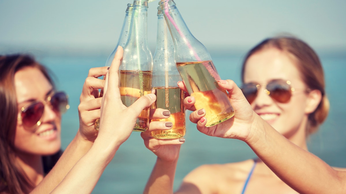 young college women drinking istock
