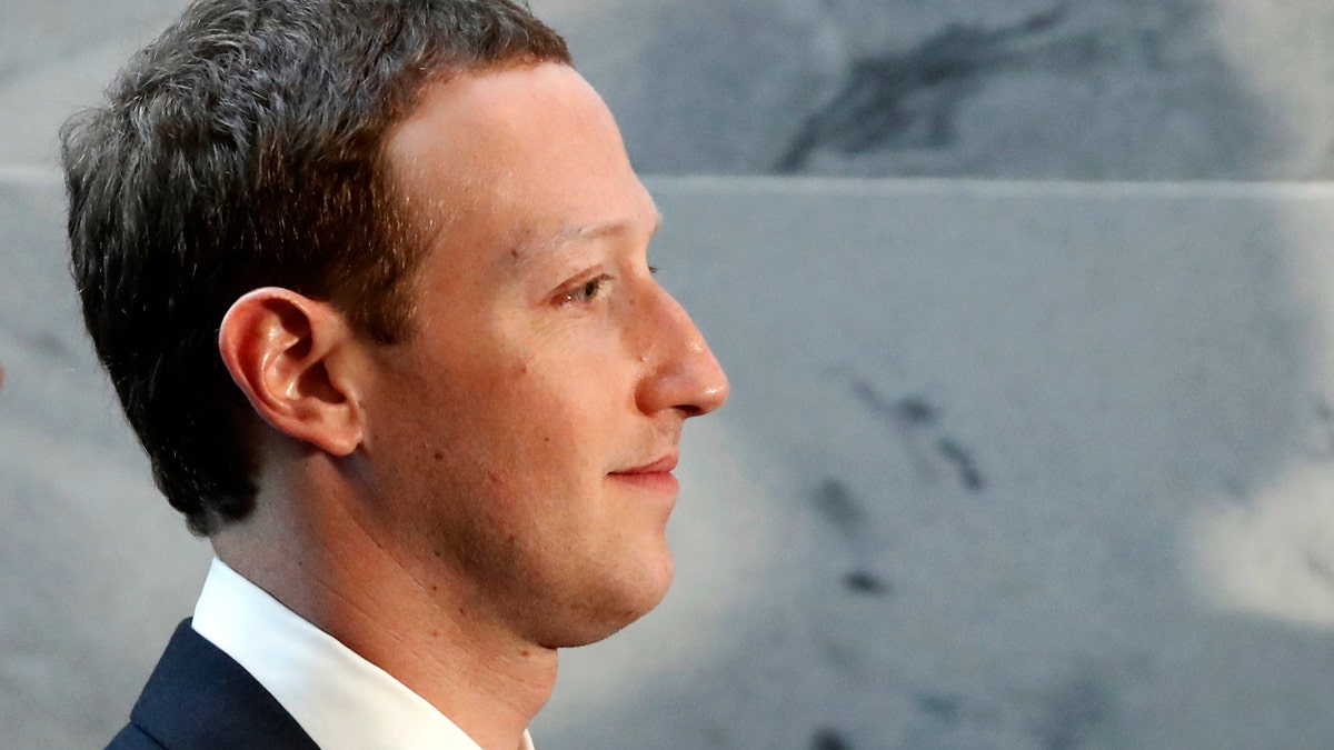 Facebook CEO Mark Zuckerberg departs after meetings with senators on Capitol Hill, Monday, April 9, 2018, in Washington. Zuckerberg will testify Tuesday before a joint hearing of the Commerce and Judiciary Committees about the use of Facebook data to target American voters in the 2016 election. (AP Photo/Alex Brandon)