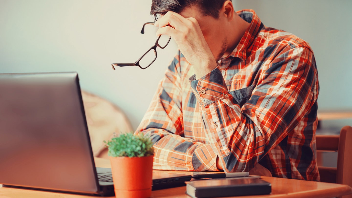 tired man at laptop istock medium