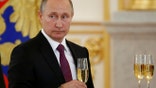 Russia's President Vladimir Putin holds a glass during a ceremony of receiving diplomatic credentials from foreign ambassadors at the Kremlin in Moscow, Russia, November 9, 2016. REUTERS/Sergei Karpukhin - RTX2SSKW
