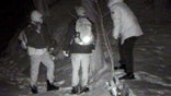 This undated surveillance photo provided by U.S. Customs and Border Protection shows people illegally crossing the United States border from Canada near Derby Line, Vt. Though attention is focused on illegal immigration into the United States from Mexico, officials and documents say there has been a quiet increase in the number of people apprehended entering illegally on the northern border between Quebec and Vermont. (U.S. Customs and Border Protection via AP)